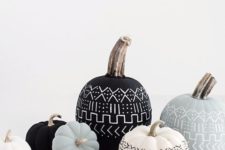 15 an elegant black, white and grey pumpkin display with patterns done with a pen