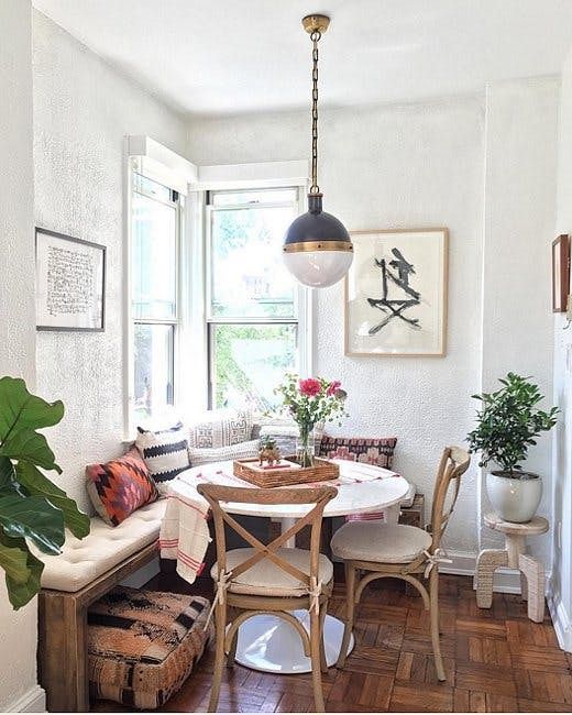 use a corner of your kitchen to create a small yet comfy dining space like this one