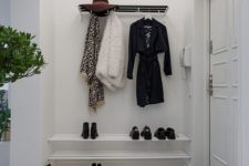 16 a stylish contemporary coat rack of metal is a comfy and simple piece for a monochromatic space