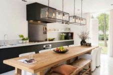 17 a contemporary kitchen is highlighted with a rustic wooden kitchen island, which is also a dining table
