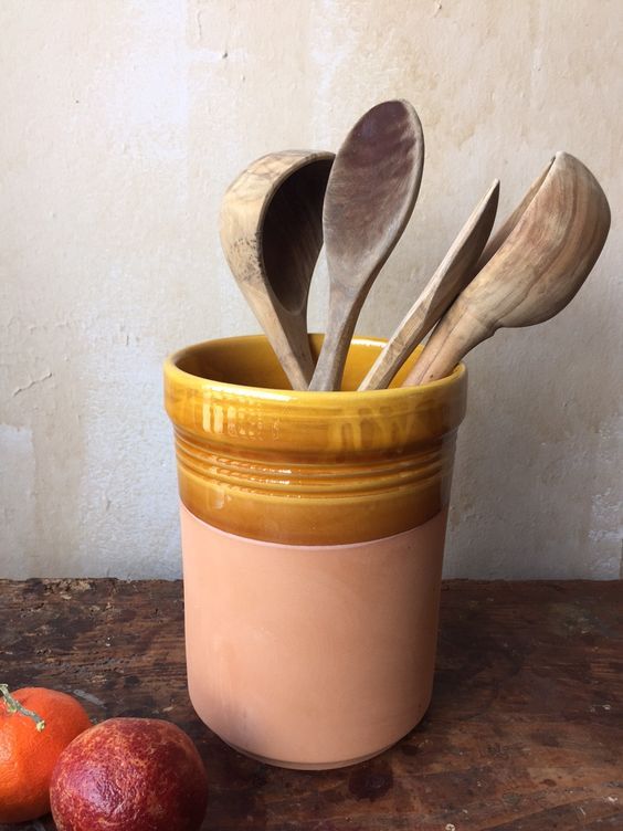 a stylish ceramic utensil holder is a chic idea for many kitchens