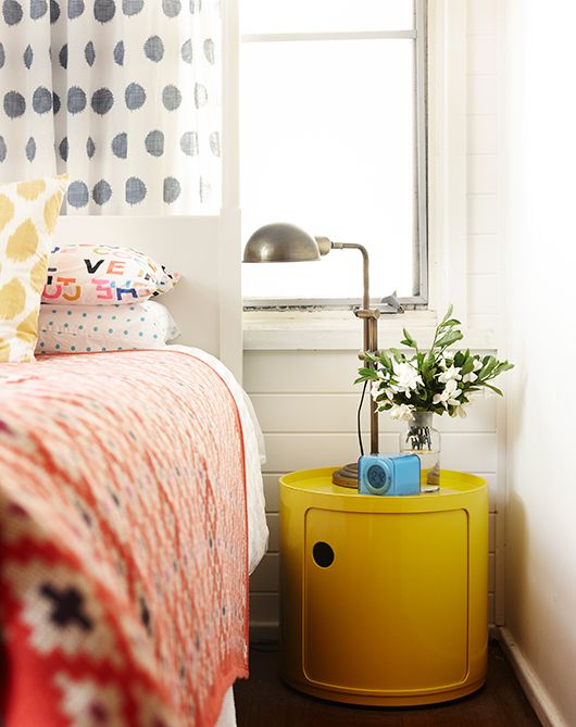 Picture Of an ultra modern yellow nightstand of a drum shape makes a