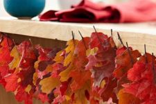 19 bring the beautiful autumn colors indoors by stringing freshly fallen oak leaves