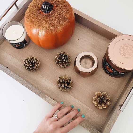 take a tray and display gilded pinecones and a pumpkin and some candles for a fall feel