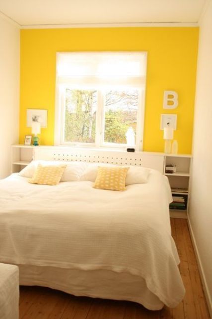 a super bold yellow statement wall is sure to fill your space with sunlight in any season