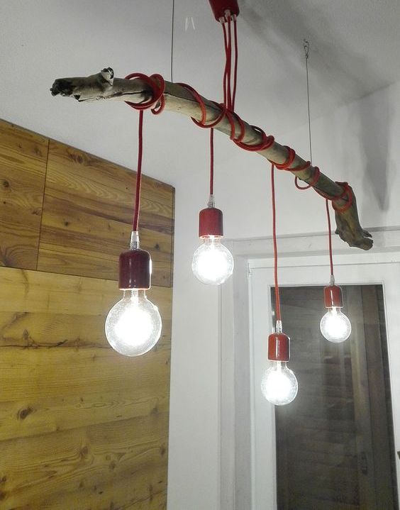 make a bold eco-style lamp using a tree branch, some colorful cord and bulbs for a bright look