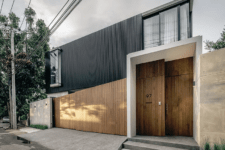 01 This ultra-modern residence is built for an extended family and faces the old home on the same plot