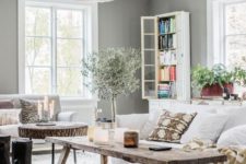 02 The living room is truly Scaninavian, with grey walls and light-colored wooden floors that were installed in 1898 and then restored