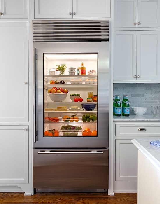 a stainless steel fridge with a clear glass door for showing off all the contents at its best