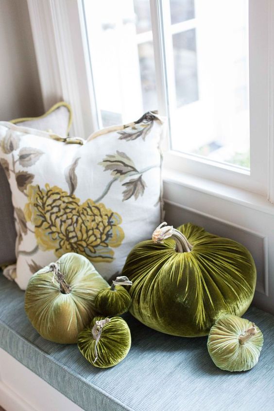 an arrangement of rich green velvet pumpkins is a chic idea for fall and Thanksgiving decor and it will last long