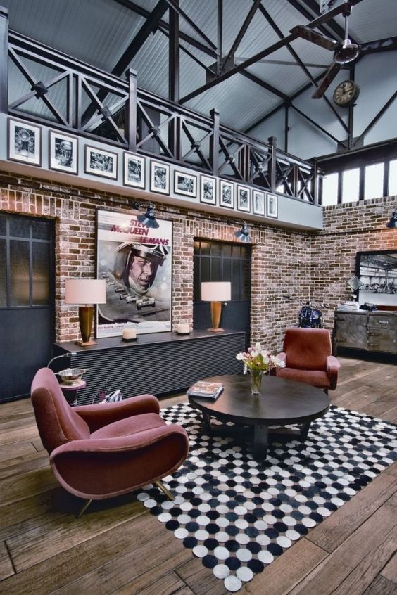 the only print here is a bright black and white polka dot rug and all the rest of the space is deprived of patterns