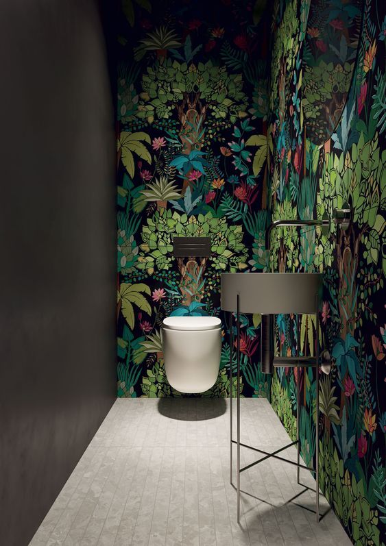 a small mudroom spruced up with super dramatic moody wallpaper and all the rest is left monochromatic