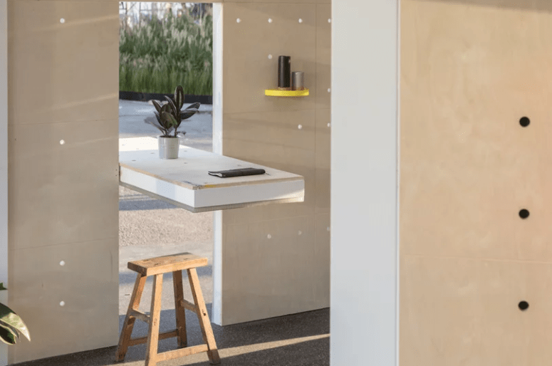 The little table can be used to close the cutout in the wall that connects indoors and outdoors