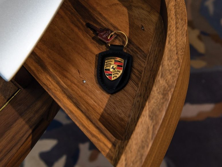 There are drawers for storage, and the refined wood highlights the design