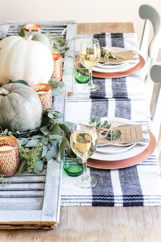 copper chargers and copper laser cut candle lanterns are a chic idea to add glam to your tablescape