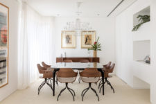 05 The dining room is done with quirky chairs, cool artworks and a chic chandelier for a statement