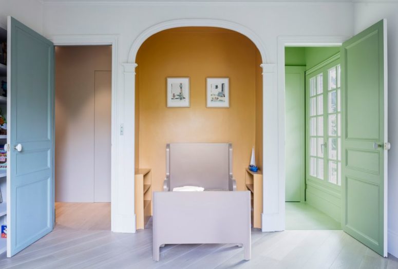 The kids' space features a colorful alcove, with a lavender bed and storage