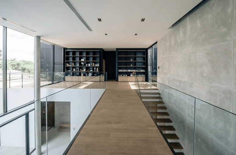 The upper space features amazing views through glazed walls and some storage spaces