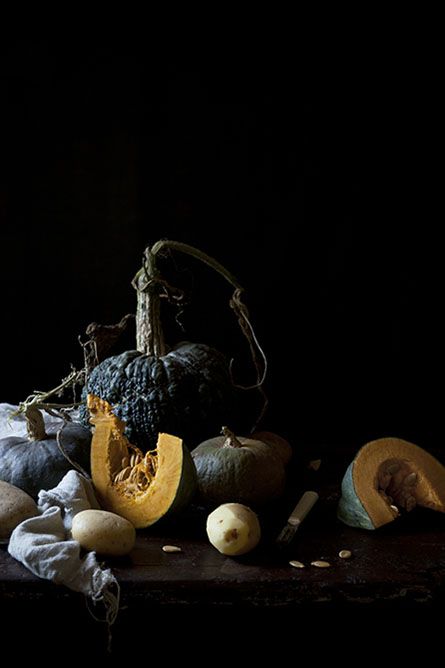 a scary arrangement with pumpkins of different kinds and cloth can be placed on a table