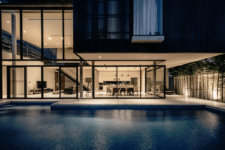 06 Extensive glazing opens the house to the garden and pool, which are still wrapped with a concrete fence to keep the privacy