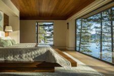 07 The master bedroom features an almost glazed wall and severla large windows, all done for amazing views
