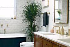 07 a welcoming mid-century modern bathroom with geometric clad tiles and penny ones on the floor plus a palm tree