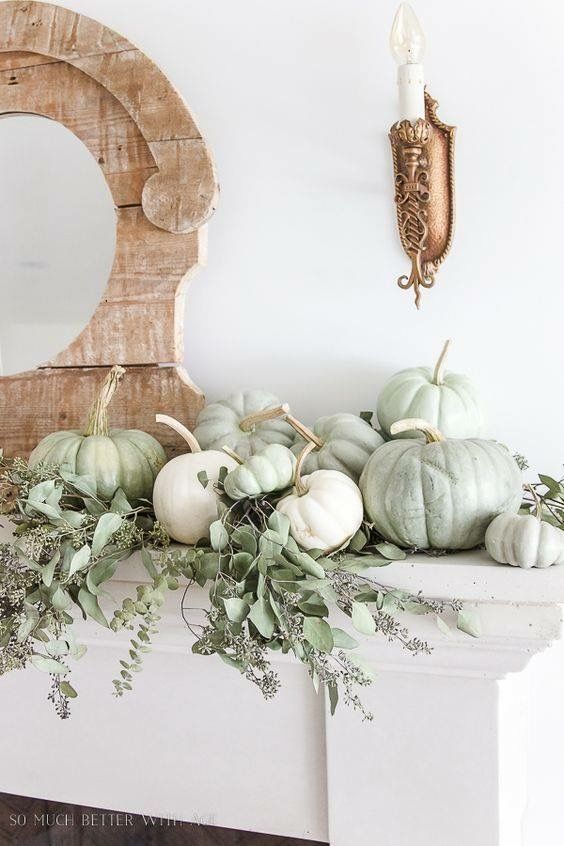 simple rustic mantel styling with white and green heirloom pumpkins and fresh eucalyptus for Thanksgiving
