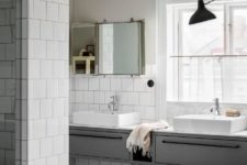08 The large bathroom features two parts, a sink zone and a bathing one
