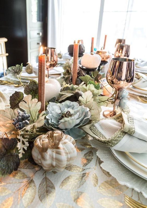 copper candles and copper glasses are a chic touch to any Thanksgiving tablescape to rock