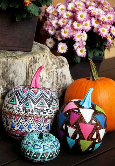 don't be afraid to go bold, try various tribal and gypsy patterns and bold colors for pumpkin decor