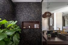 09 The shower clad with real pebbles and potted greenery make you feel like outdoors