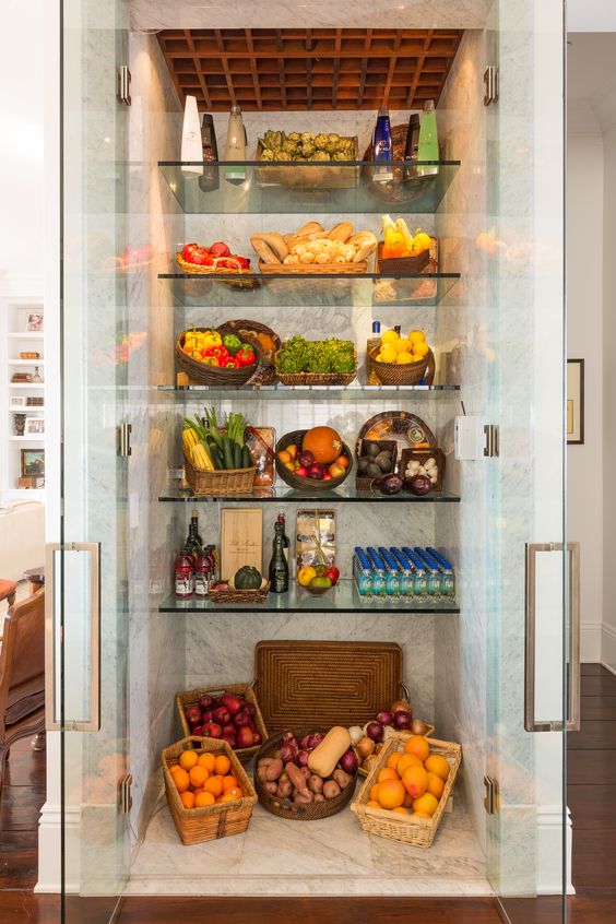 a large fridge with glass doors and glass shelves is a great extra display and it will make the kitchne fele more open