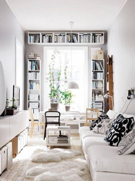 prints are added to this neutral space with monochromatic yet patterned pillows on the sofa