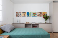 11 There’s also a guest bedroom with a single bed and some storage items plus colorful artworks