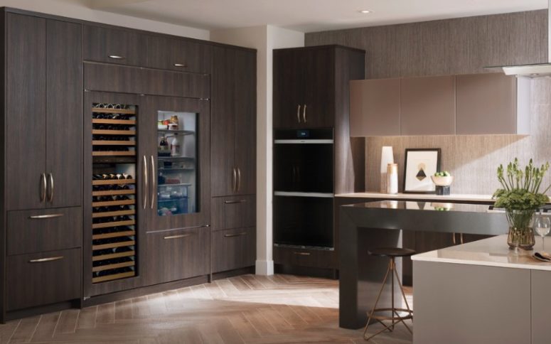 integrate your fridge and wine cooler into your wooden cabinets to keep the kitchen more unified and sleek