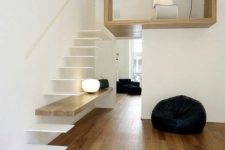 14 an ultra-minimalist staircase with white floating steps and a shelf integrated into the construction