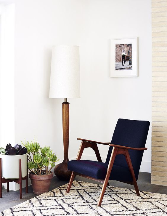 wood in all shades and colors is a characteristic feature of mid century modern decor style
