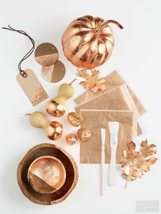 copper bowls, leaves, acorns, faux pears and tags will make your tablescape bold, bright and glam-like