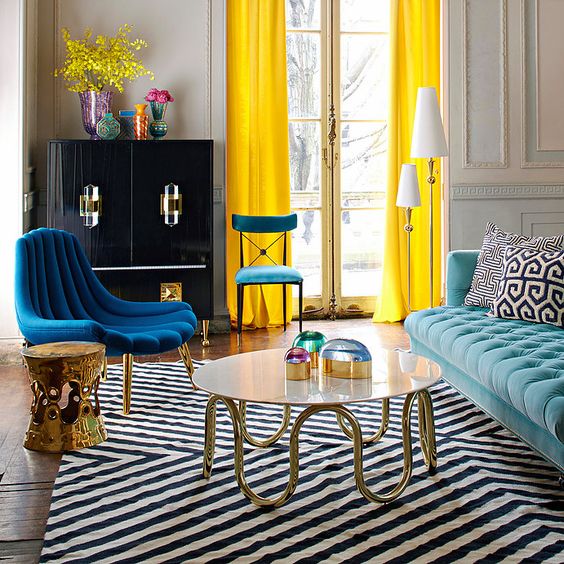 a dramatic chevron rug in black and white plus printed pillows that add interest, too