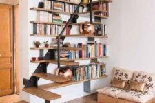 17 a floating metal and wood staircase integrated into the bookshelves on the wall