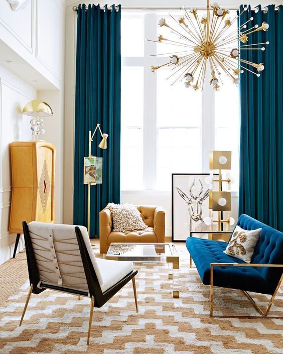 a printed rug is the main print item in the living room, and the pillows are secondary things