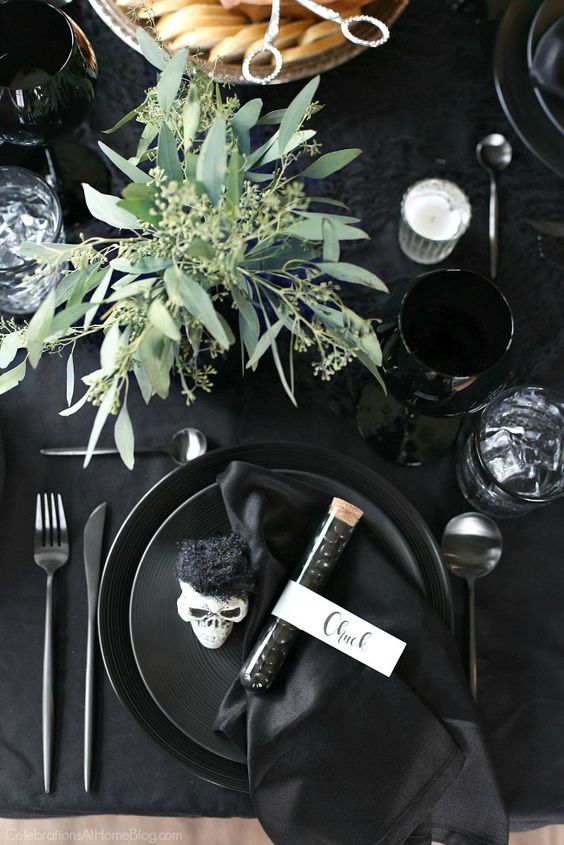 a simple seeded eucalyptus centerpiece will add life to your black tablescape and make it feel cooler