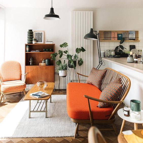 warm orange and coral are mixed with fresh greenery and calmed down with natural wood