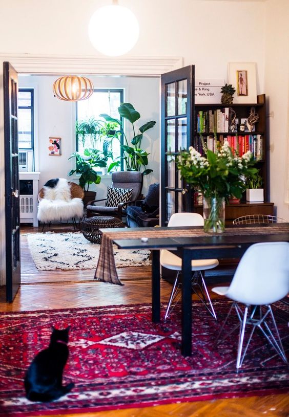two spaces united into one by opening the doors and bright and different prints on textiles and upholstery