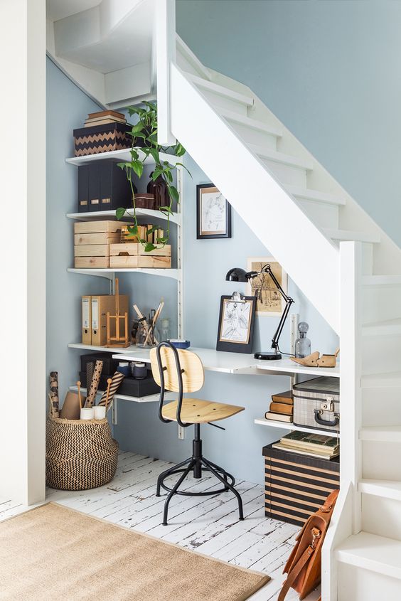 a small yet functional and cozy crafting space under the stairs is a good idea to use the dead space