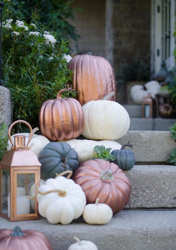 place a batch of pumpkins on the stairs and include copper ones plus a copper lantern to make it more stylish