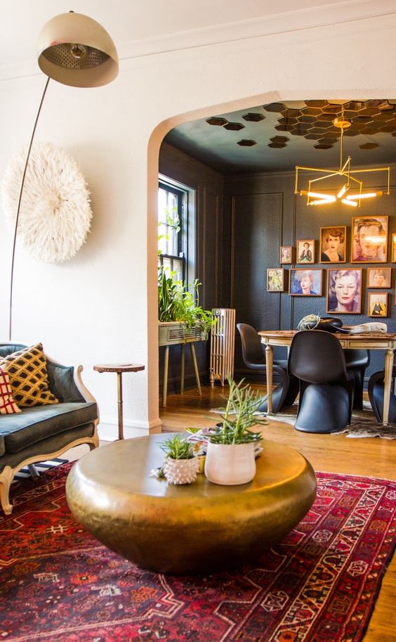boho prints in the living room and geometric prints on the ceiling of the dining room