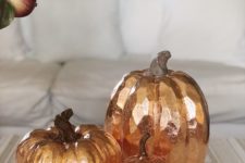24 take some faux pumpkins and decorate them with copper leaf to make a simple and chic fall decoration