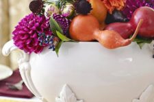 25 a vintage soup bowl filled with fall fruits and veggies, bright blooms and berries in bright jewel tones