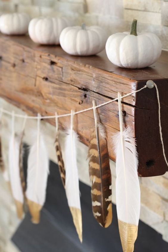skip usual skull and candy corn buntings and go for a dipped feather garland for a boho feel in your space